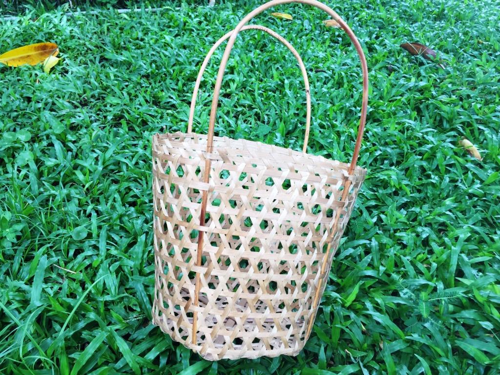 Eye-shape basket with rattan handles