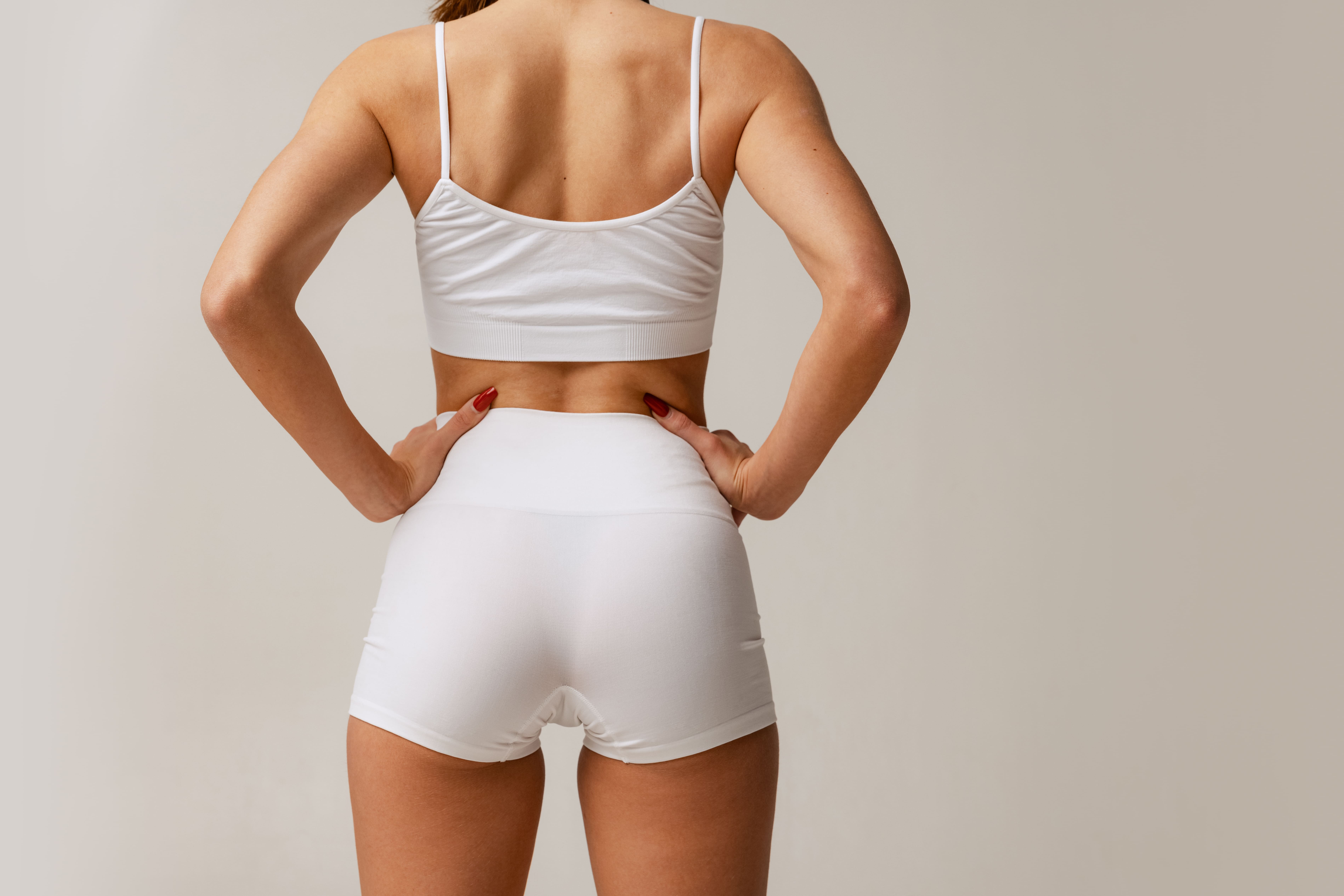 White High-waist Panties And Bra On Sportive Booty. Slim Woman