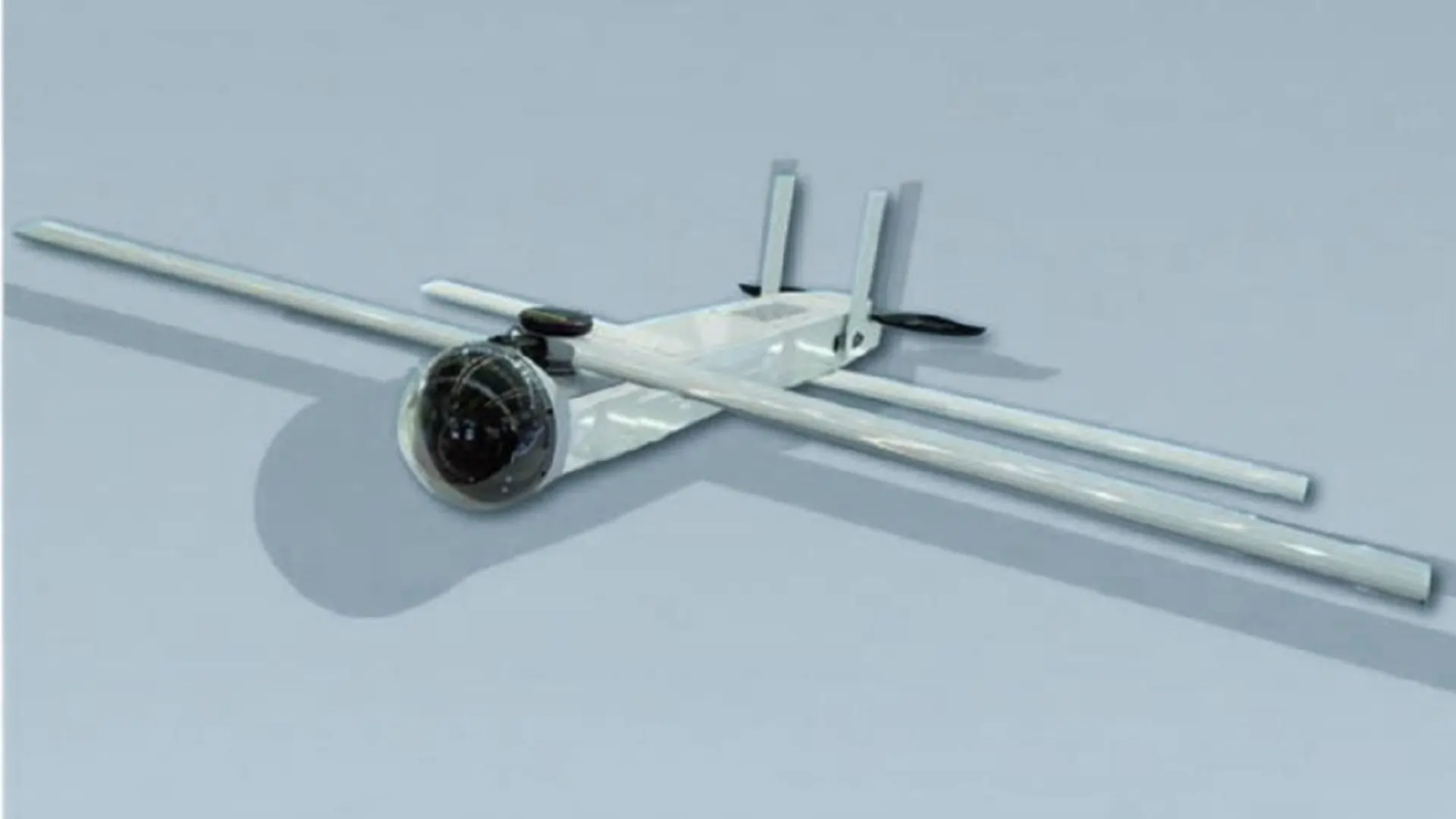 Kamikaze drone with black oval tube in front and four wings by its side