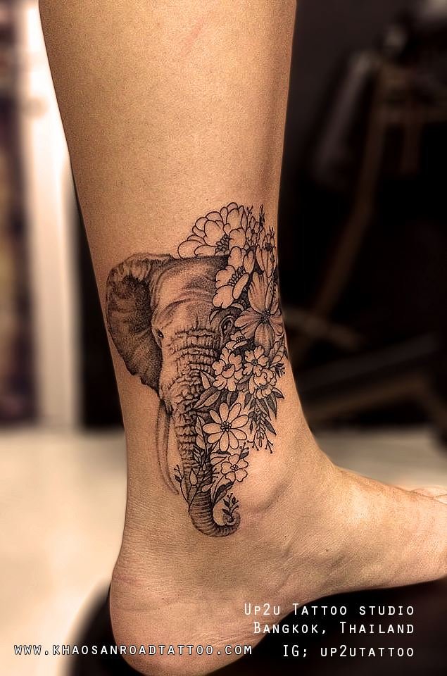 Elephant with flowers Tattoo - khaosanroadtattoo