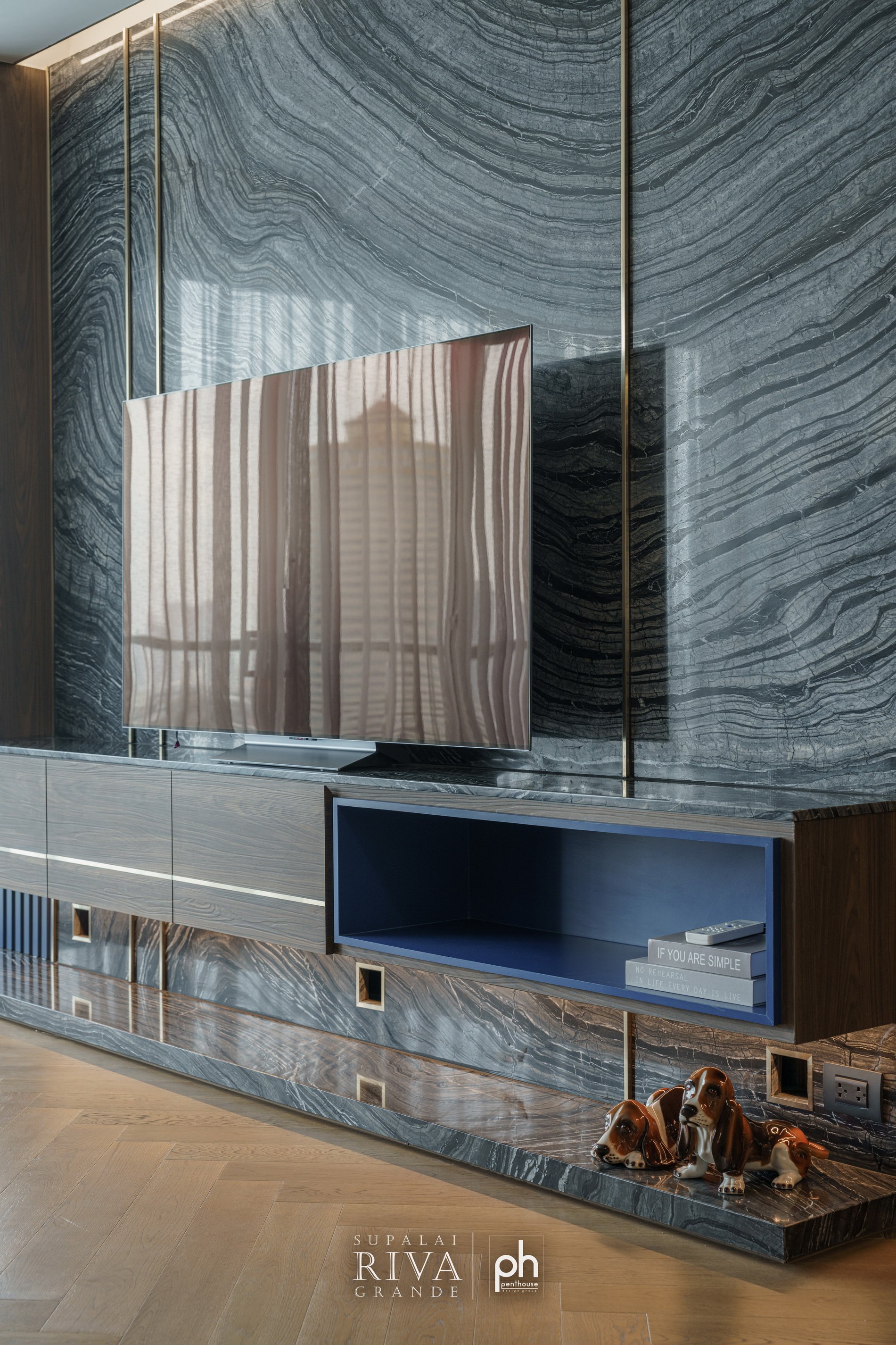Stone television wall at Supalai Riva Grande, coordinated with existing conditions