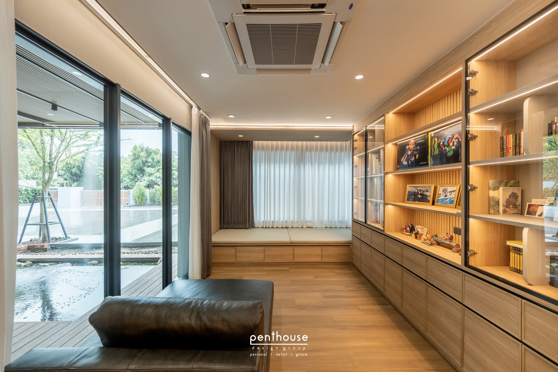 Real Theera House window seating beside shelving for books and collections