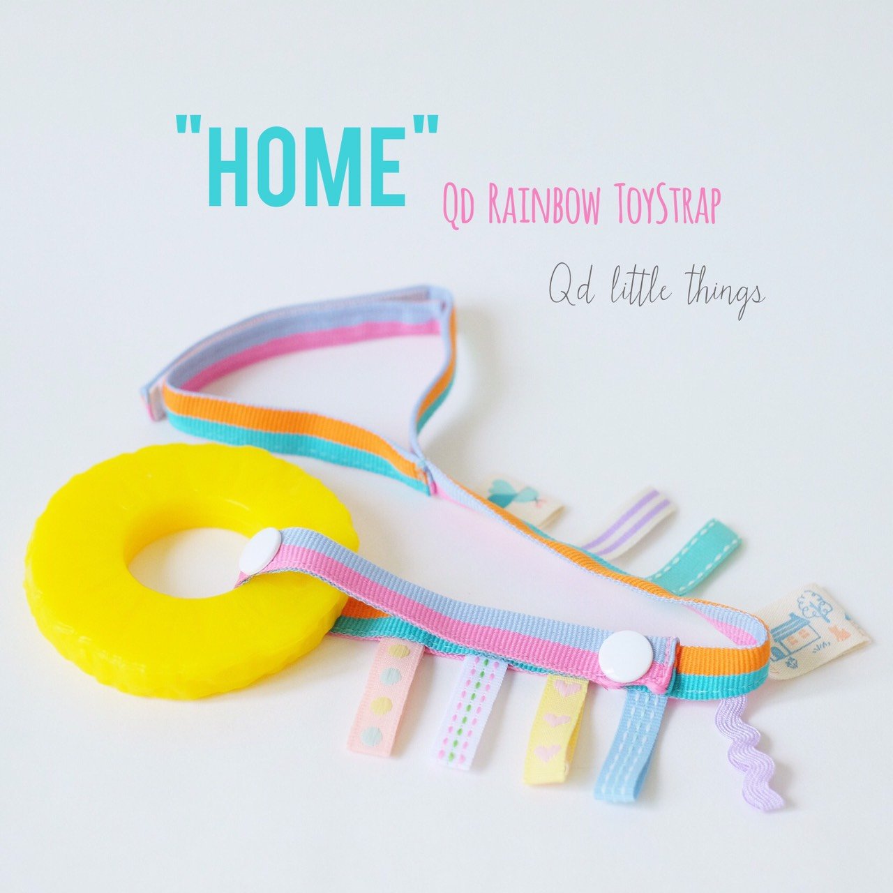 Qd Rainbow ToyStrap - Home