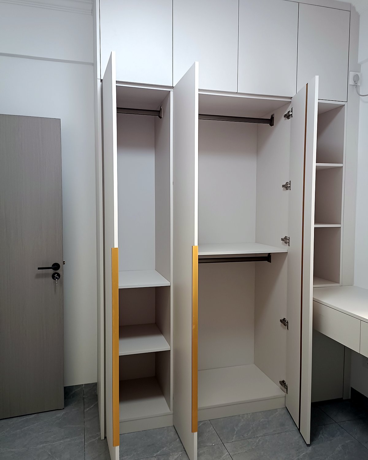 Open built-in wardrobe showing long hanging, short hanging and folded shelves