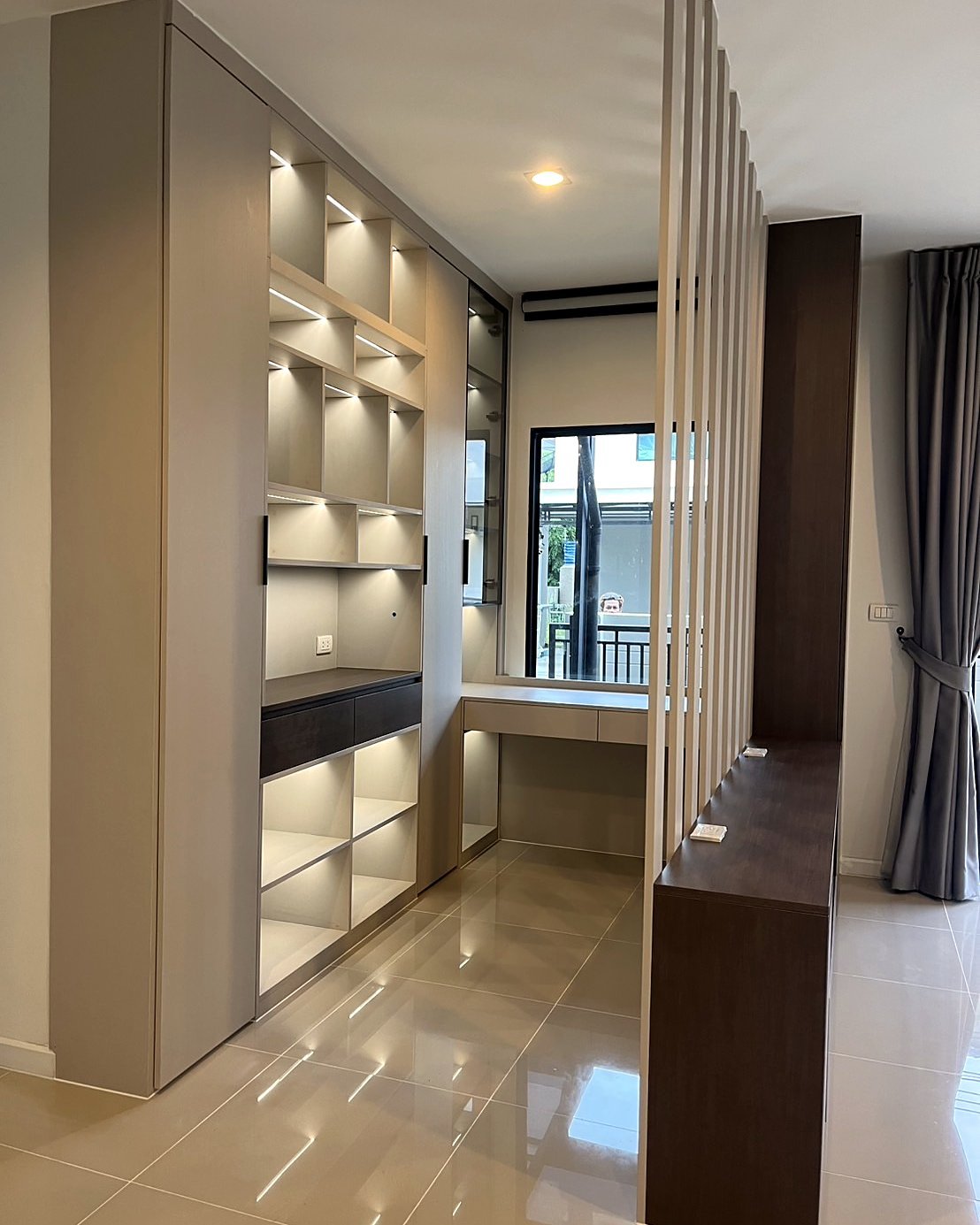 Built-in shelving with concealed LED lighting for a soft, warm glow
