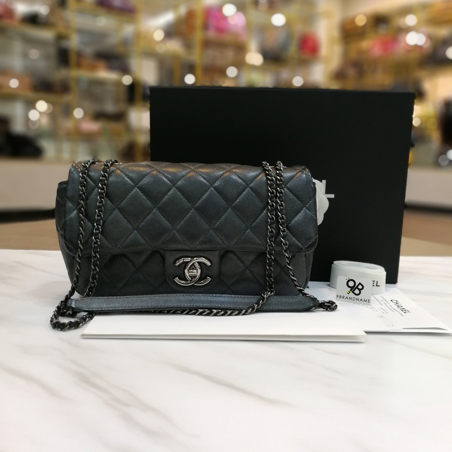 Used -​ Chanel Eyelet Flap Metallic Dark Silver Calfskin Quilted