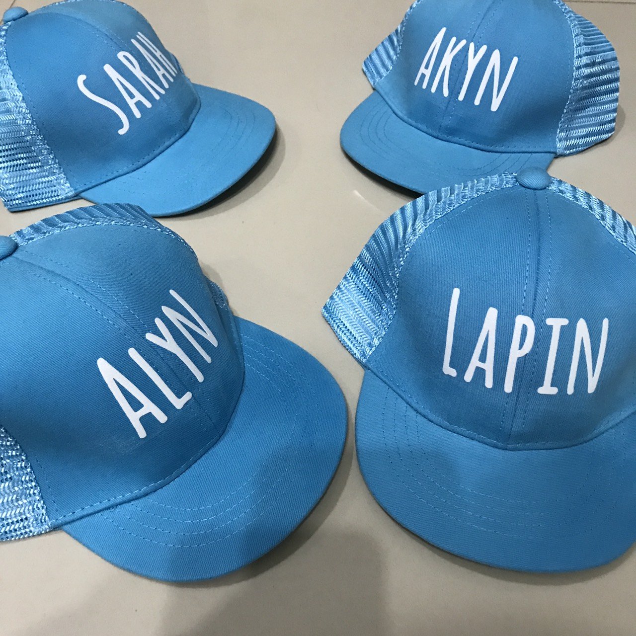 หมวก made to order สีฟ้าพิมพ์สีขาว
