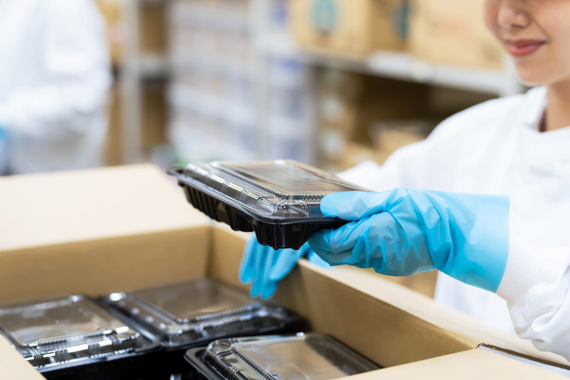 A person working in a packaging factory