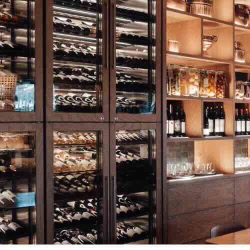 Primio Commercial wine cooler with glass door and stainless steel frame for temperature-controlled wine storage