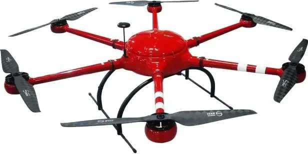Red fire fighting drone with six legs and each legs have two white stripped