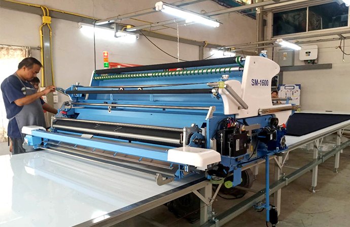 เครื่องปูผ้า