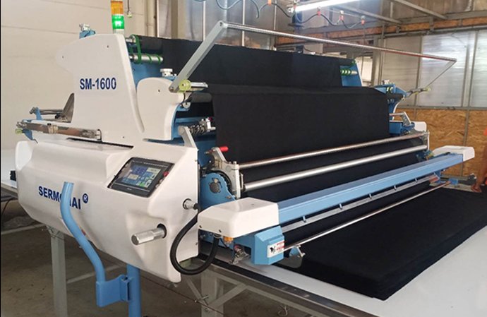 เครื่องปูผ้า