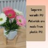 ช่อดอกเยอบีร่าในกระถางเบลล่า 5 นิ้ว ขาตั้งไม้ Gerbera flower bouquet in a 5-inch Bella pot.