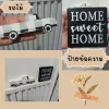 รถไม้และป้ายตกแต่งแนววินเทจ Wooden cars and vintage-style decorative signs.