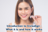 Confident woman displaying her Invisalign aligner, showcasing a modern alternative to braces.
