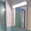Wall-mounted Smart LED Bathroom Mirror – Ultra-clear glass with built-in LED lighting, perfect for bathrooms and wash areas. Features a durable stainless steel frame and customizable sizing to fit your space.