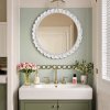 Bring timeless charm to your home with this French vintage-style wall mirror in a soft cream finish
