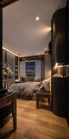มุมห้องนอนจากโต๊ะเครื่องแป้งไปยังเตียงในคอนโด Baan Klang Krung 494