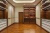 Choosing Boards for Built-ins: MDF, HMR, Plywood and Particle Board ภาพถ่ายงานจริง The Palazzo แสดงตู้เสื้อผ้า ชั้น และลิ้นชักในห้องแต่งตัว / Completed-project photograph of The Palazzo showing wardrobes, shelves and drawers in a dressing room