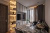 Small Condo Layout and Storage: How to Avoid a Crowded Room ห้องนั่งเล่นจริง Ideo Q Victory มีโซฟา โต๊ะ และแนวตู้โทรทัศน์พร้อมชั้นเปิด / Completed Ideo Q Victory living room with a sofa, table and television storage wall with open shelves