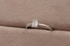Emerald Cut Diamond With Peg Head Setting Solitaire Ring