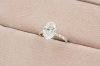 Oval Cut Diamond With Hidden Halo and Pavé Solitaire Ring