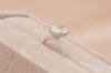 Oval Cut Diamond With Hidden Halo and Three Sides Pavé Il