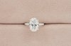 Oval Cut Diamond With Hidden Halo and Three Sides Pavé Il
