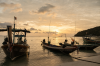 Local fishing boats moored at sunset