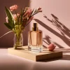 Bottle of perfume with flowers