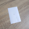 A black dot on white paper A black dot on white paper