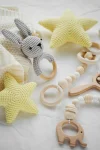 Yellow stars and wooden teether