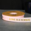 ริบบิ้นผ้าลาย LOVE IS ETERNALสีชมพูอ่อนกว้าง 2.5 ซม. ยาว 45 หลา พิมพ์ลายสีทอง (สินค้าพร้อมส่ง) ริบบิ้นผ้า ริบบิ้นผ้า