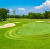 Aerial view of a lush green golf course in Thailand