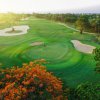 Hole 1 photo with beautiful flower around the greens and Bunker