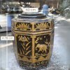 Octagonal ceramic jar with designs of tree, mouse, lotus, cow, bamboo, dragon, lotus, and elephant