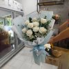 A bouquet of 9 white roses