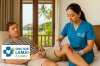 Doctor treating a motorbike accident wound on a patient's knee at Doctor Lamai Clinic, koh samui