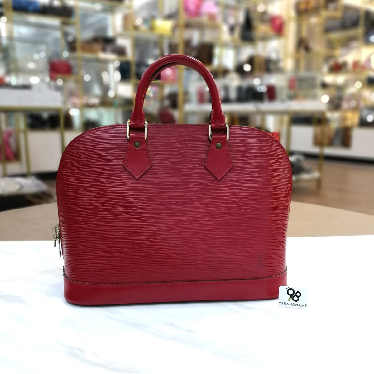 louis vuitton alma epi red