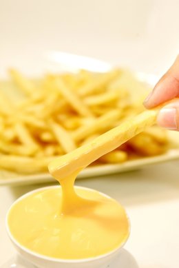 Cheese dip, french fries and fries. Added to the taste, delicious, cheesesy dip.