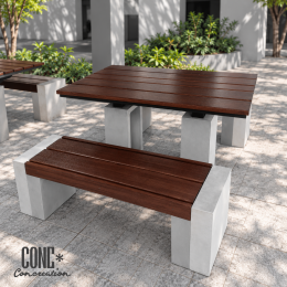 ผลงานชุดโต๊ะสนามและม้านั่งปูน CONC Concreation จัดวางหลายชุดบริเวณพื้นที่พักผ่อนปั๊มน้ำมัน จังหวัดสระแก้ว ที่นั่งลายไม้สีเข้มและฐานปูนซีเมนต์สีเทา