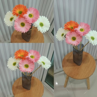 ช่อดอกเยอบีร่าในกระถางเบลล่า 5 นิ้ว ขาตั้งไม้ Gerbera flower bouquet in a 5-inch Bella pot.