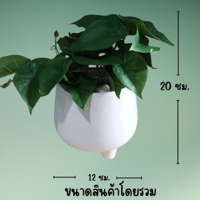 ต้นไม้เลื้อยปลอมในกระถางดินเผาทรงนมวัว Artificial vine plant in cow-shaped ceramic pot.