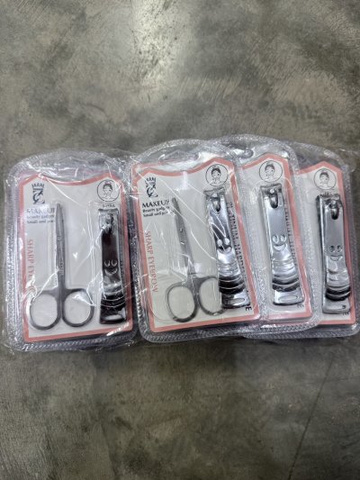 60043#ชุดกรรไกรตัดเล็บ+กรรไกรตัดขน 12 ชิ้น /โหล ราคา 20 บาท
