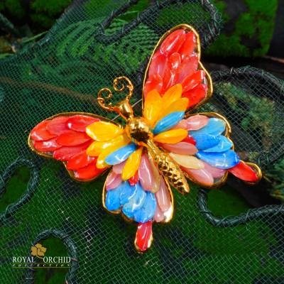 Clear-coated aster petel flower butterfly brooch.