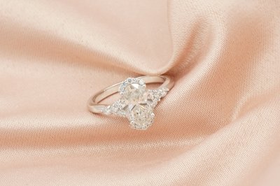 Oavl Cut Diamond With Side Stones and Halo Solitaire Ring