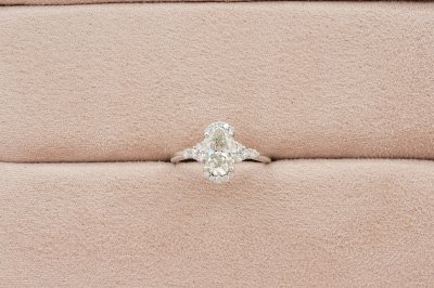 Oavl Cut Diamond With Side Stones and Halo Solitaire Ring