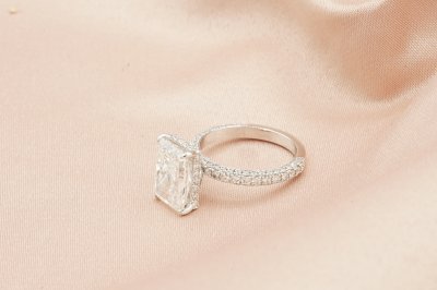 Radiant Cut Diamond With Hidden Halo and Three Sides Pavé