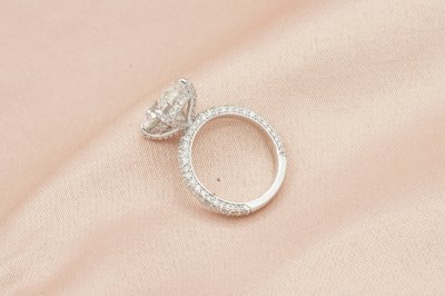 Oval Cut Diamond With Hidden Halo and Three Sides Pavé Il