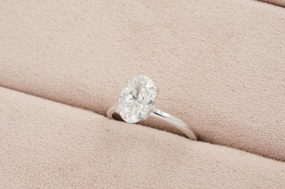 Oval Cut Diamond With Flower Shaped Basket Solitaire Ring